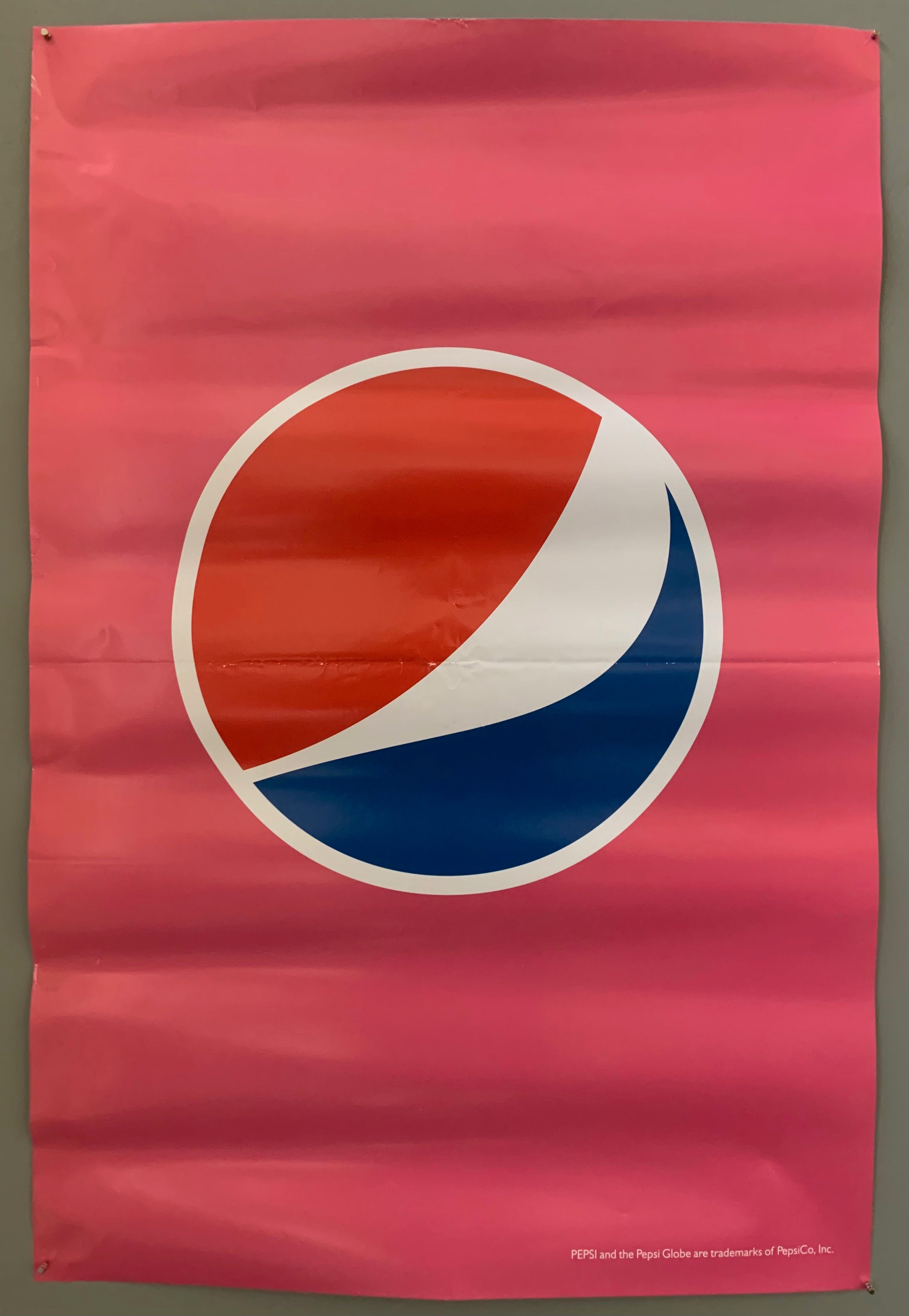 pepsi logo on a pink background