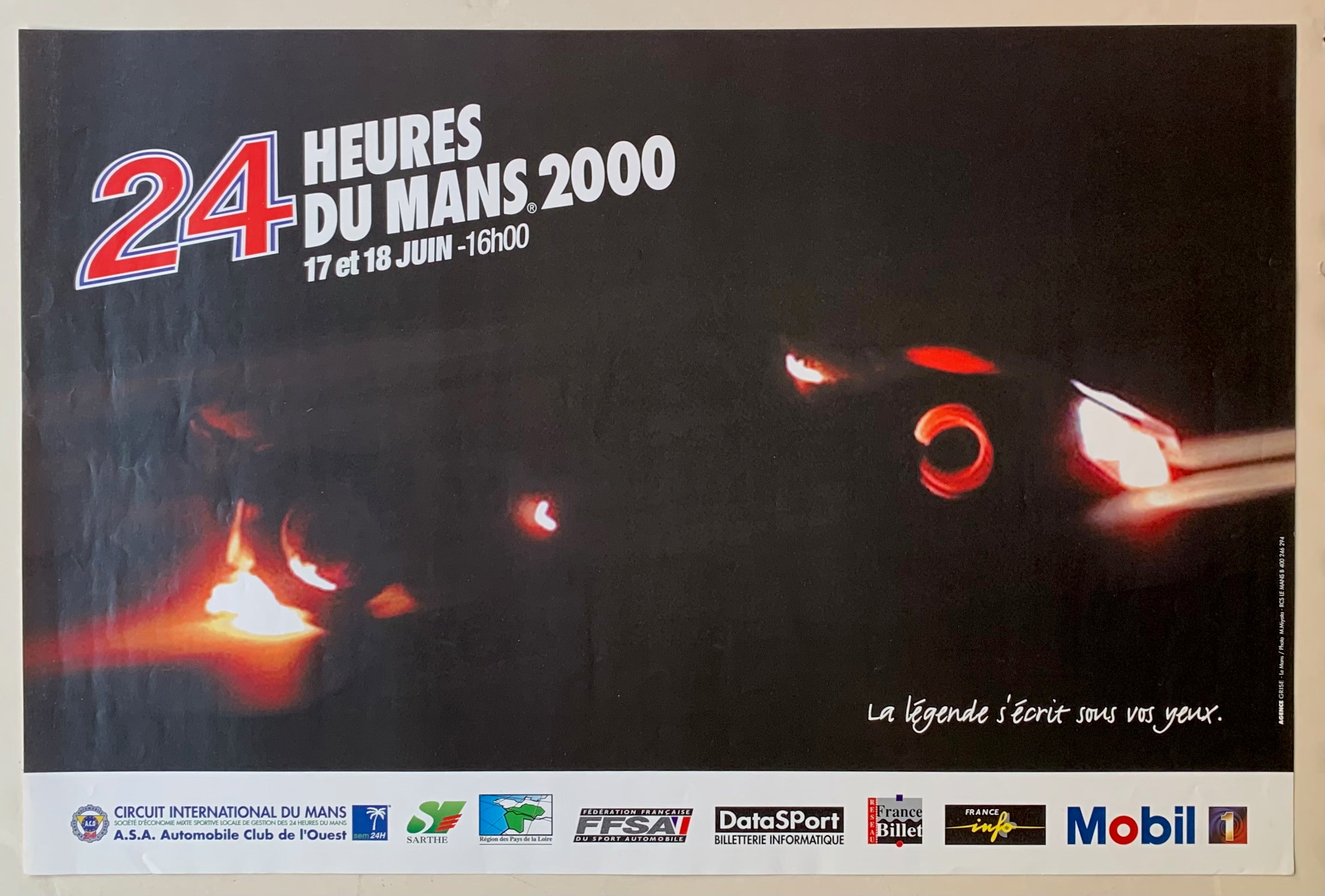 16x24 24 heures du mans 2000 poster featuring glowing red racecar in the dark and partner company logos